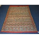 A South American style rug, with allover geometric designs on red ground,