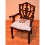 A reproduction child's carver armchair in the Victorian style,