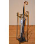 A Brass umbrella/stick stand, with four divisions, 61cm high,