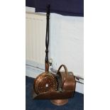 A vintage copper coal helmet, 40cm high, together with a copper bed warming pan,