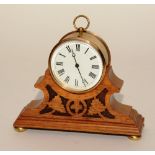 A 19th century French brass desk clock, of drum form with loop handle,