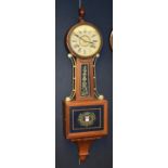 An American 'Banjo' wall clock, the drum head dial with Roman Numerals,