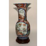 A large 19th century Chinese Imari vase, with flaring neck,