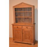 A Victorian pine plate rack, with open shelves, raised on a Victorian and later dresser base,