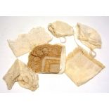 A small quantity of antique lace, to include baby hats,