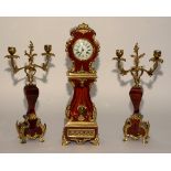 A French Louis XVI style red tortoiseshell and gilt metal clock garniture,