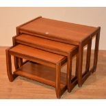 A nest of three 1960's retro teak tables,