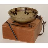 A Chinese brown stoneware bowl, unmarked to base, but with Chinese leaflet enclosed, in wooden box,