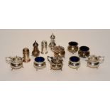 A collection of silver condiments, hallmarks for Birmingham 1918-19, to include four pepper pots,