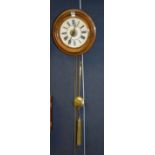 A vintage mahogany framed circular wall clock, dial 17.