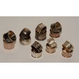 A collection of silver napkin rings, to include one pair, hallmarks for London 1912-13,