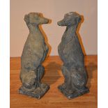 A pair of composite stoneware dog figures, in seated upright position,
