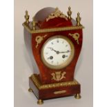 A 19th century French Louise XVI style red tortoiseshell and ormolu mantel clock,