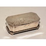 A silver jewellery box, of rectangular form with canted corners,