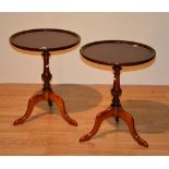 A pair of reproduction wine tables, with circular top raised on turned column and tripod supports,