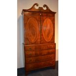 An early 19th century George III style mahogany napery press on chest,