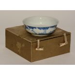 A Chinese blue and white bowl, decorated with stalk in foliage, character marks to base and side,