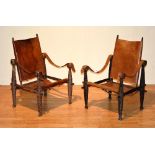 A pair of vintage African officers chairs, with removable tan leather back rests and seats,
