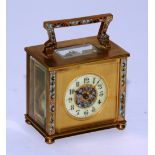 A late 19th century French champleve enamel and brass carriage clock,