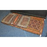 Two Eastern saddle bags, decorated with multiple diamond lozenge on brown and purple ground,