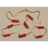 A 9ct gold and coral necklace, the fine brick link chain set with eight twists of coral,