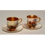 A pair of Royal Worcester cabinet cups and saucers, signed by Harry Stinton circa 1924,