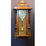 An early 20th century mahogany cased Vienna wall clock,