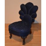 A Victorian mahogany nursing chair, with shaped back rest,