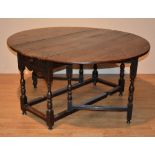 An 18th century oak gateleg table, with drawer to both ends,