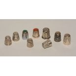 A small quantity of silver and white metal thimbles, of varying patterns and designs,