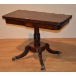 A 19th century Regency mahogany fold over tea table,