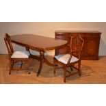 A good reproduction walnut eight piece dining room suite, comprising of sideboard,