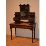 A late Victorian mahogany dressing table, with swing mirror, and two drawers to table base,