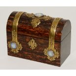 A Victorian coromandel stationary box, the domed lid opening to reveal fitted interior,