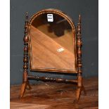 A 19th century rosewood inlaid apprentice toilet mirror, the arched swing mirror,