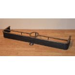 An antique iron fire curb, with circular insert for pot or kettle,