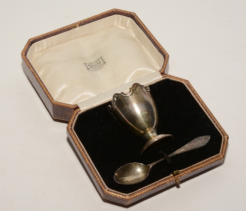 A Harrods boxed silver christening set, comprising egg cup and teaspoon,