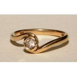 A 10ct gold solitaire diamond ring, the brilliant cut diamond measuring approximately 0.