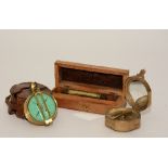 A brass pocket compass by Elliot Bros of London, 7cm diameter, in fitted leather case,