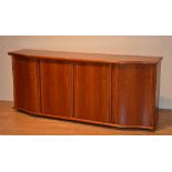 A Danish cherry wood sideboard by Skovby, with four panelled doors, enclosing shelved interior,