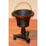 A William IV mahogany jardiniere, with swing metal handle and liner,