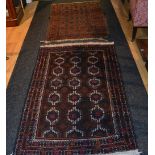 Two small Eastern rugs, one with central panel decorated with multiple guls on brown ground,