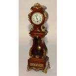 A French Louis XVI style walnut and ormolu gilt metal mantel clock,
