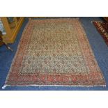 An Eastern rug, with allover floral diamonds on white ground with triple foliate border,