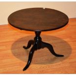 A George III mahogany circular tripod table,