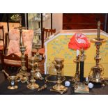 A quantity of church brass stands and candlesticks, mortar & pestle,