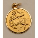 An 18ct gold pendant/charm in the form of Sagittarius, stamped 750 to roundel, 2.