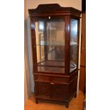 A Chinese hardwood display cabinet, with glazed door enclosing glass shelf,
