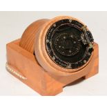 A military World War II handheld 'Bomber' compass, held within wooden mallet and stand, no 42800D,