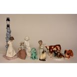 A mixed lot of porcelain figures, to include Nao figural table lamp, Lladro angel figure,